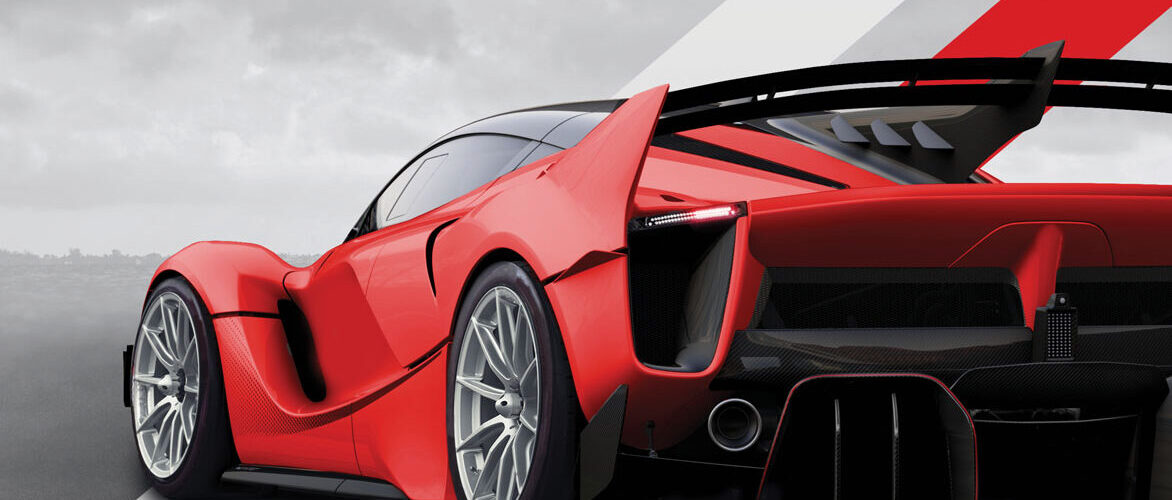 Czerwony sportowy samochód z dużym spojlerem Czerwony sportowy samochód z dużym spojlerem i nowoczesnym designem na tle szarym.